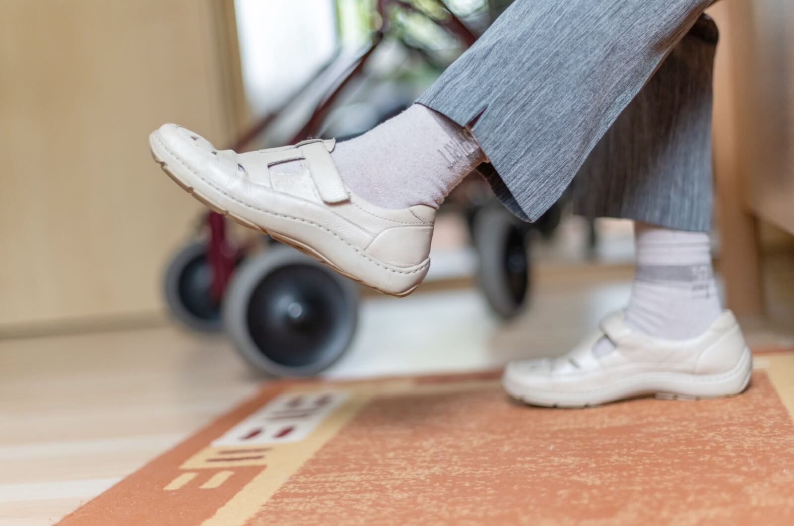 A close-up view of an older adult with dementia wearing a comfortable, easy-to-wear shoe.